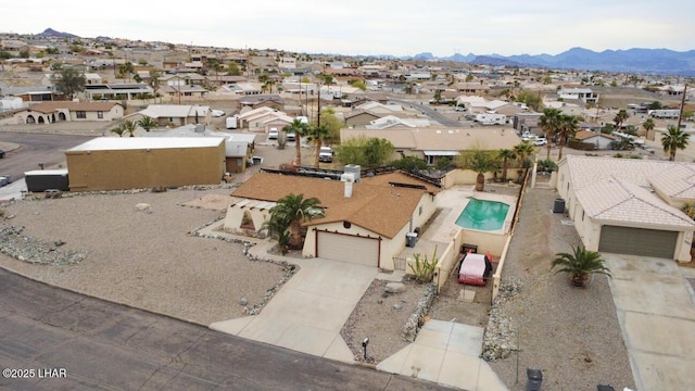 drone / aerial view featuring a mountain view and a residential view