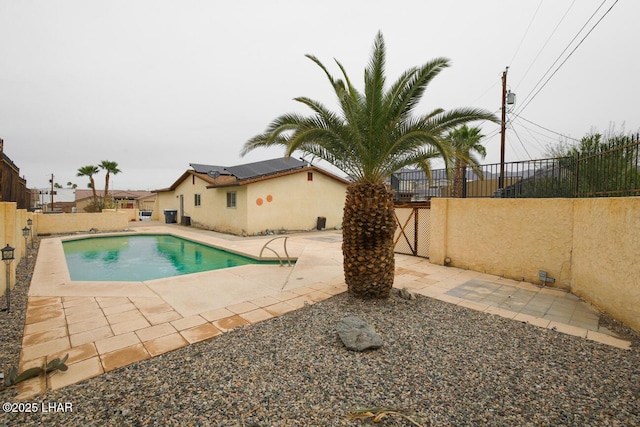 view of pool with a patio area, a fenced in pool, and a fenced backyard