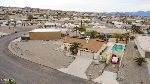 birds eye view of property with a residential view and a mountain view