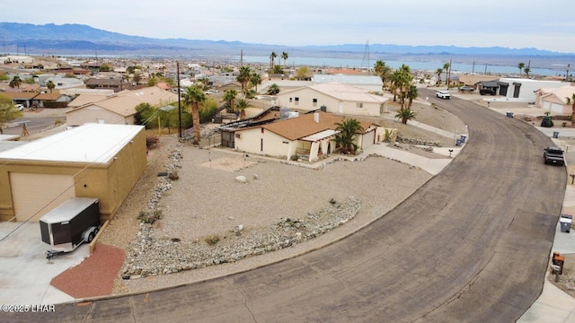 drone / aerial view featuring a mountain view and a residential view