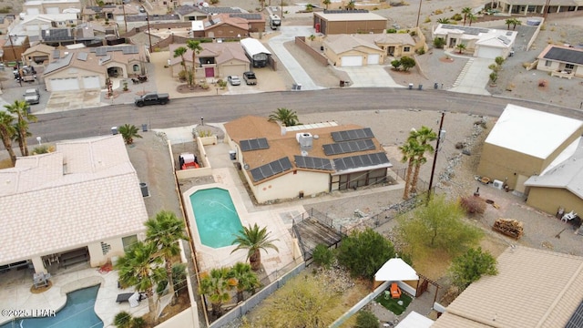 birds eye view of property with a residential view