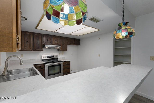 kitchen with visible vents, a sink, under cabinet range hood, light countertops, and stainless steel electric range oven