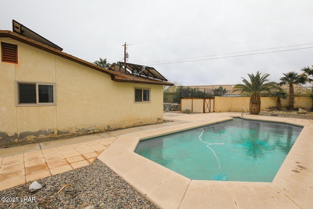 view of pool featuring a fenced in pool, a patio, and fence