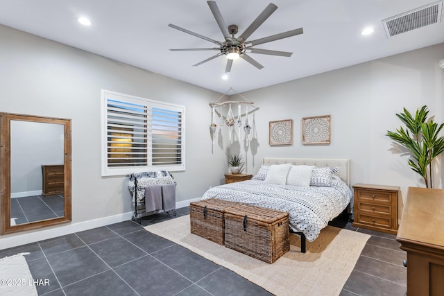 tiled bedroom with ceiling fan