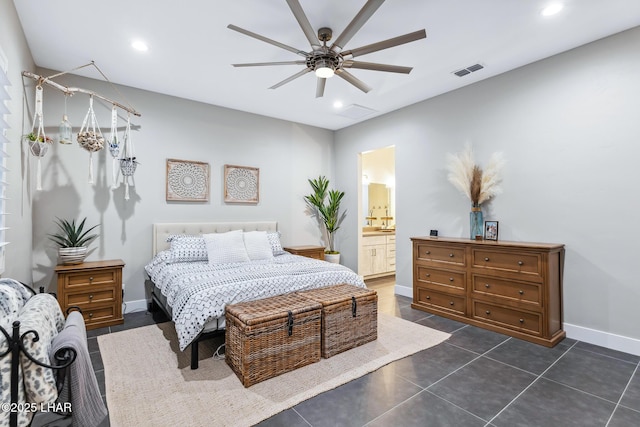 tiled bedroom with ceiling fan and connected bathroom