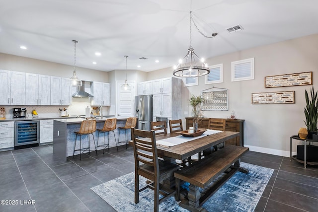 tiled dining area featuring wine cooler