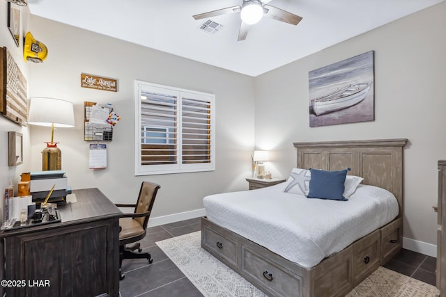 bedroom with dark tile patterned flooring and ceiling fan