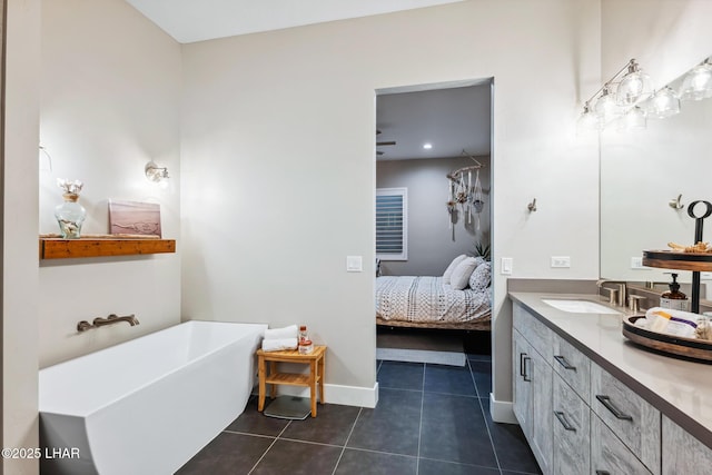 bathroom with vanity, tile patterned floors, and a bathtub