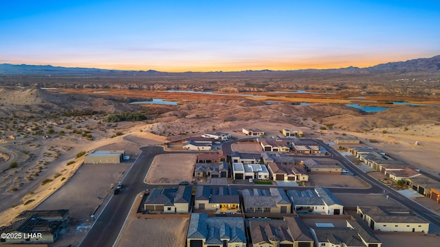 aerial view at dusk with a mountain view