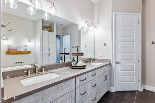 bathroom with vanity and tile patterned floors