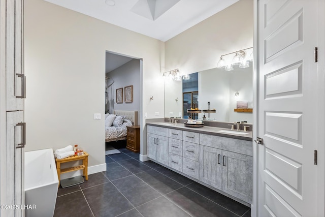 bathroom featuring tile patterned flooring and vanity