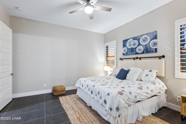 tiled bedroom with ceiling fan