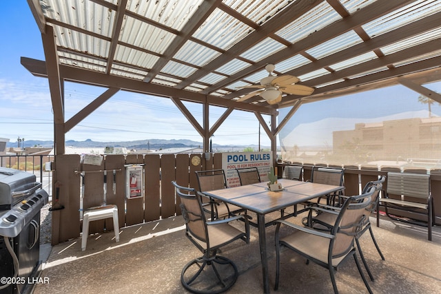1850 Swanson Ave Unit A16, Lake Havasu City, AZ 86403 - view of patio with grilling area, a ceiling fan, outdoor dining space, and a mountain view