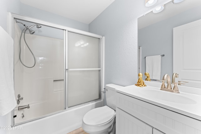 1850 Swanson Ave Unit A16, Lake Havasu City, AZ 86403 - bathroom with a textured wall, vanity, shower / bath combination with glass door, and toilet
