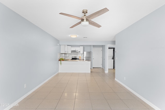1850 Swanson Ave Unit A16, Lake Havasu City, AZ 86403 - unfurnished living room featuring a ceiling fan, baseboards, and light tile patterned floors