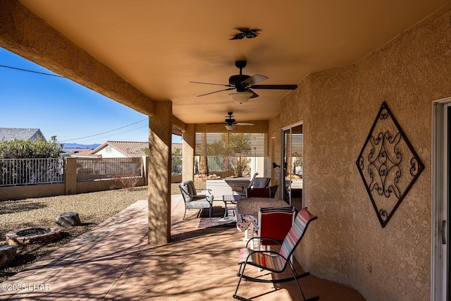 view of patio / terrace featuring ceiling fan