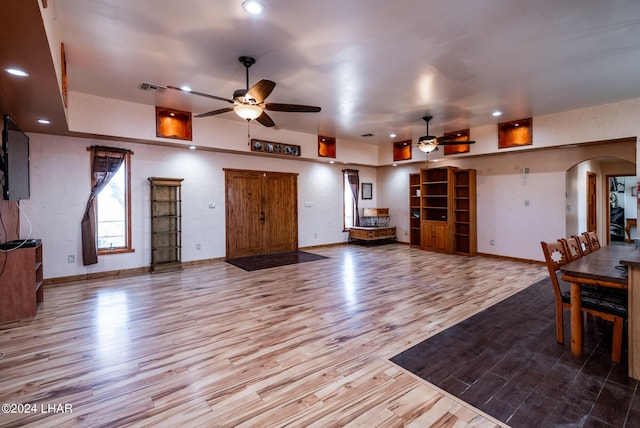 interior space featuring ceiling fan and light wood-type flooring