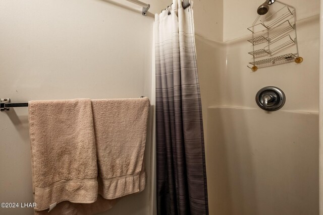 bathroom with a shower with shower curtain