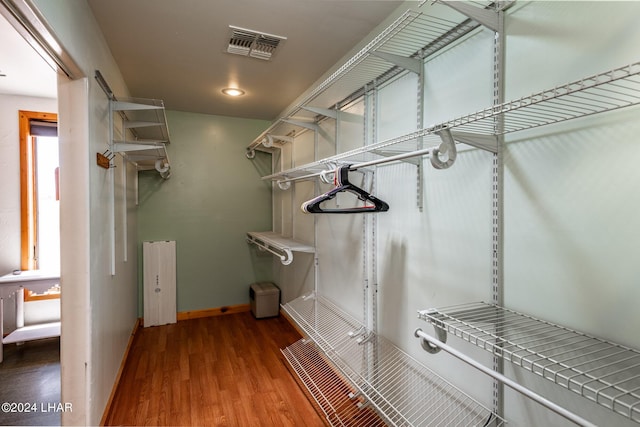 walk in closet featuring hardwood / wood-style flooring