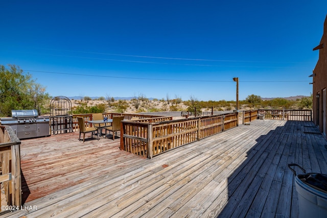 wooden terrace with area for grilling