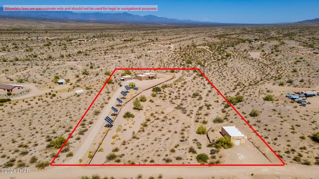 birds eye view of property featuring a mountain view