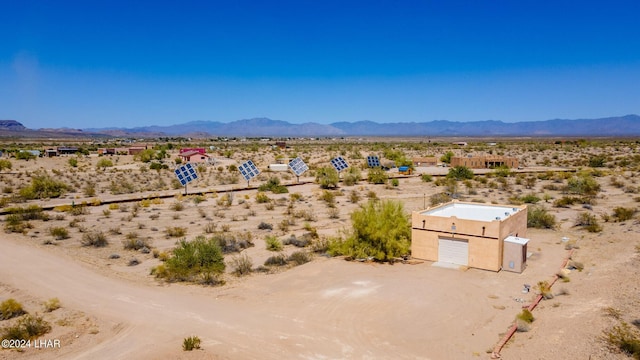 birds eye view of property with a mountain view