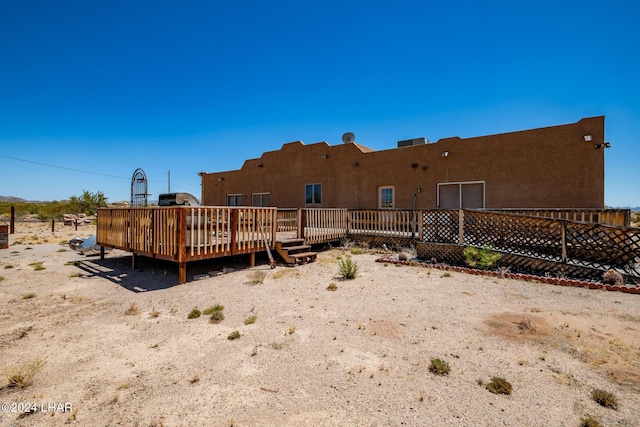 rear view of house with a deck