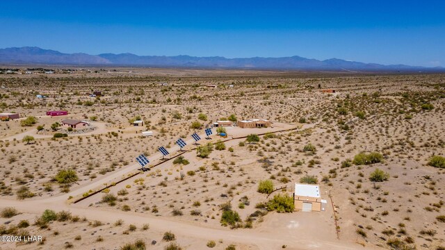 birds eye view of property featuring a mountain view