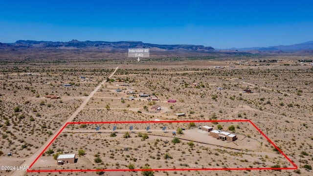 birds eye view of property with a mountain view