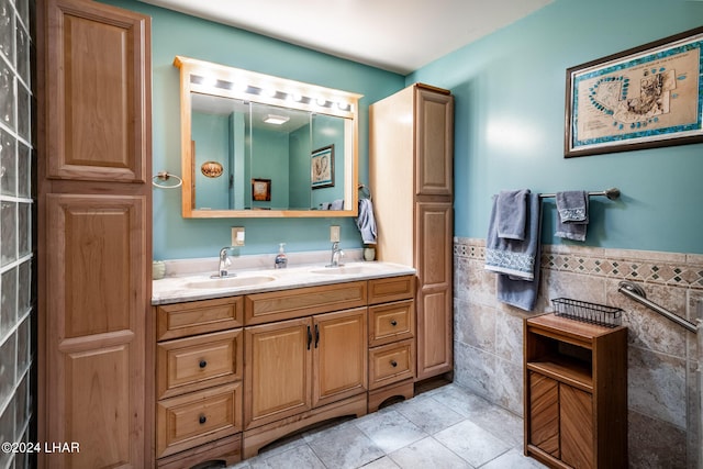 bathroom with vanity, tile walls, and tile patterned floors