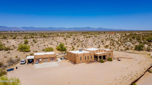 birds eye view of property with a mountain view