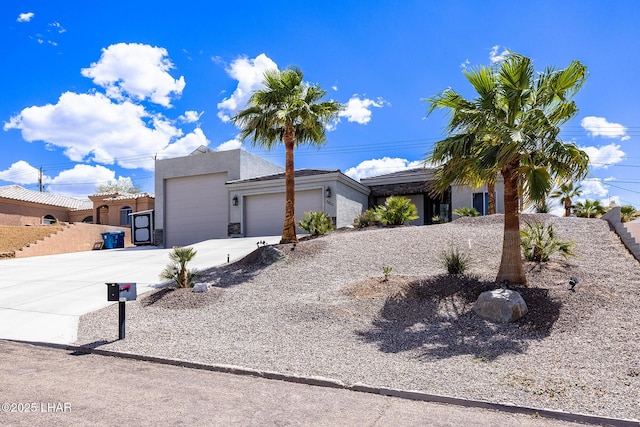 2800 Papeete Dr, Lake Havasu City, AZ 86404 - view of front of home with an attached garage, concrete driveway, and stucco siding