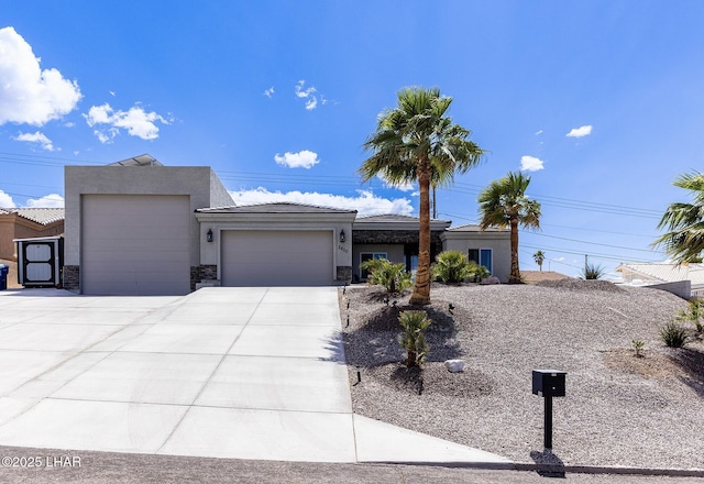 2800 Papeete Dr, Lake Havasu City, AZ 86404 - view of front facade featuring driveway, stucco siding, an attached garage, and a tile roof