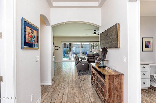 2800 Papeete Dr, Lake Havasu City, AZ 86404 - corridor featuring arched walkways, light wood-style floors, and baseboards