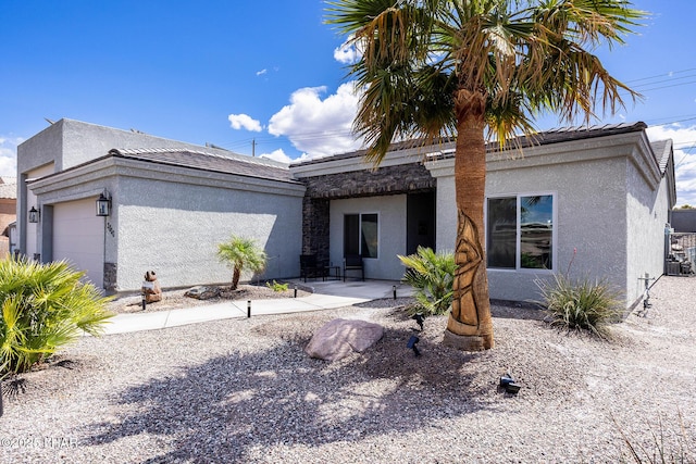 2800 Papeete Dr, Lake Havasu City, AZ 86404 - view of front of property with an attached garage, a patio area, stucco siding, and a tile roof