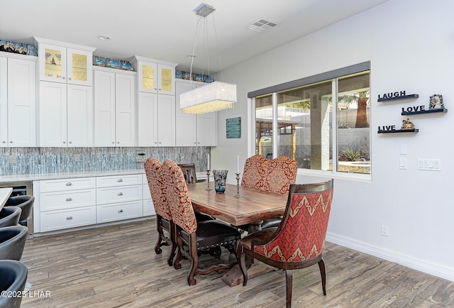 2800 Papeete Dr, Lake Havasu City, AZ 86404 - dining space with visible vents, baseboards, and wood finished floors