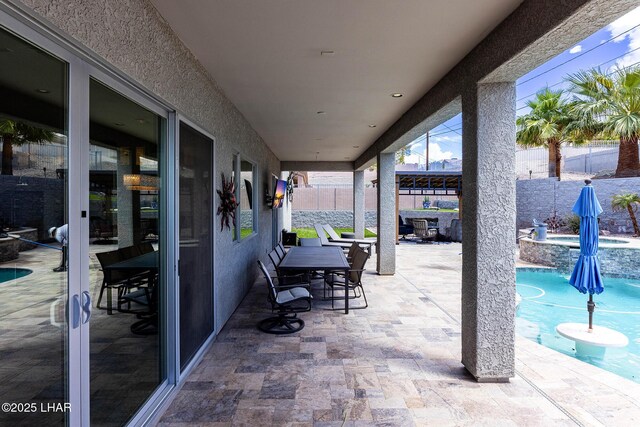 2800 Papeete Dr, Lake Havasu City, AZ 86404 - view of patio / terrace featuring a pool with connected hot tub and a fenced backyard