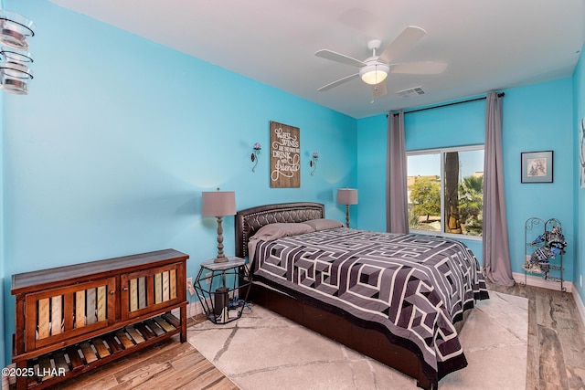 2800 Papeete Dr, Lake Havasu City, AZ 86404 - bedroom with visible vents, baseboards, a ceiling fan, and wood finished floors