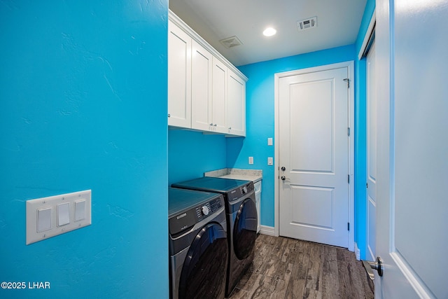 2800 Papeete Dr, Lake Havasu City, AZ 86404 - washroom with visible vents, dark wood-style floors, cabinet space, and washer and clothes dryer