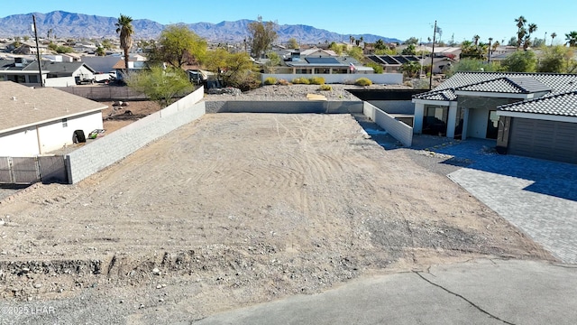 drone / aerial view featuring a residential view and a mountain view