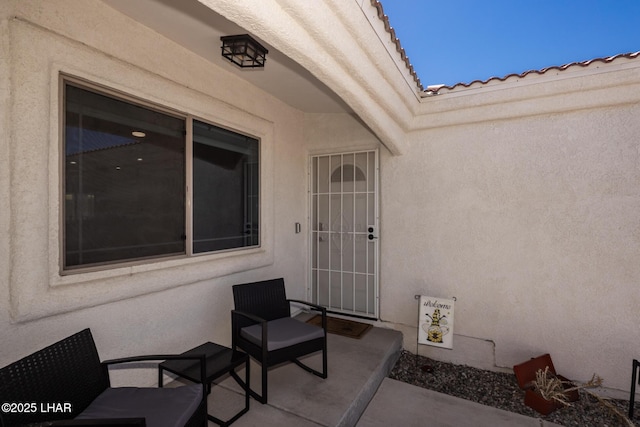 2764 Daytona Ave, Lake Havasu City, AZ 86403 - view of exterior entry with a patio area, stucco siding, and a tile roof