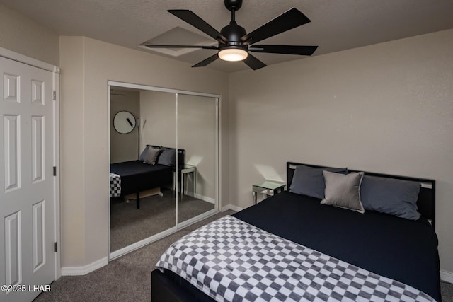 2764 Daytona Ave, Lake Havasu City, AZ 86403 - bedroom with baseboards, ceiling fan, dark carpet, and a closet