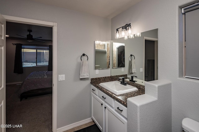 2764 Daytona Ave, Lake Havasu City, AZ 86403 - bathroom with vanity, connected bathroom, ceiling fan, and toilet