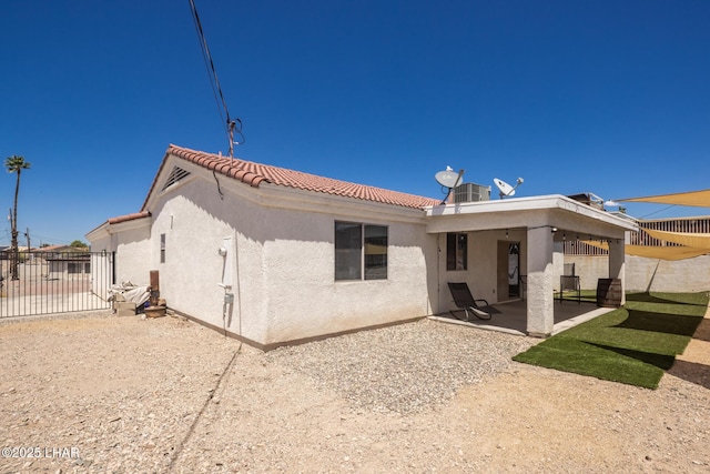 2764 Daytona Ave, Lake Havasu City, AZ 86403 - back of property with a patio area, stucco siding, a tiled roof, and fence