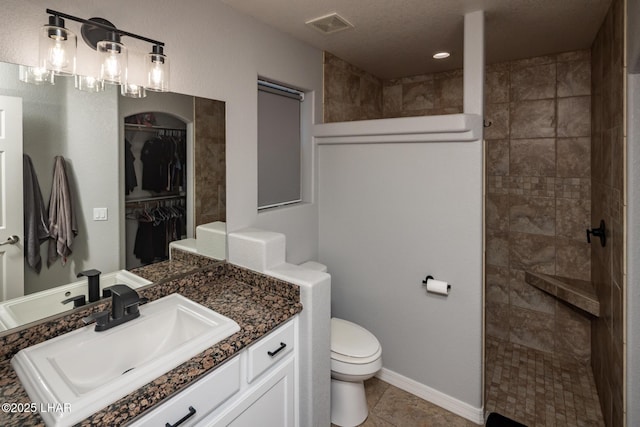 2764 Daytona Ave, Lake Havasu City, AZ 86403 - full bath with a tile shower, tile patterned flooring, vanity, toilet, and visible vents