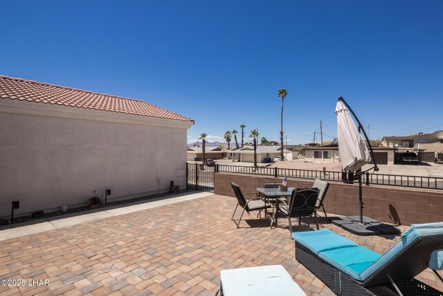2764 Daytona Ave, Lake Havasu City, AZ 86403 - view of patio / terrace featuring fence, a gate, and outdoor dining space