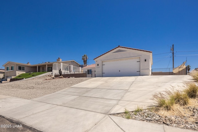 2764 Daytona Ave, Lake Havasu City, AZ 86403 - single story home with concrete driveway, fence, and stucco siding