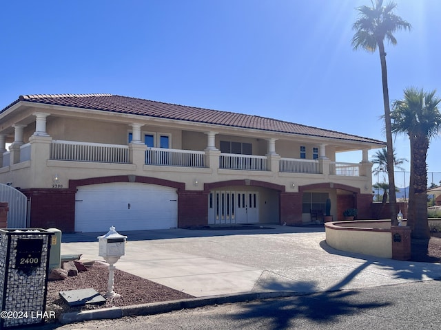 mediterranean / spanish-style house featuring a garage