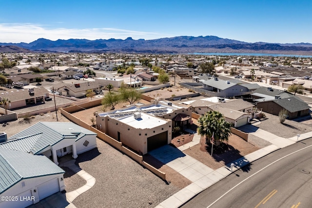 drone / aerial view with a residential view and a mountain view
