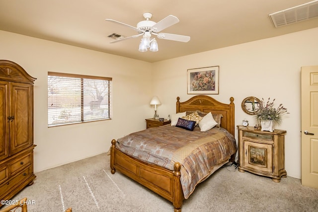 bedroom featuring light carpet, a ceiling fan, and visible vents